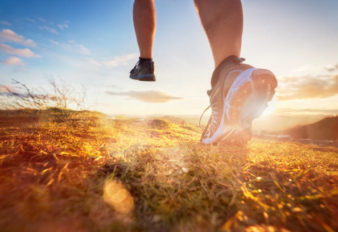 Outdoor cross-country running in morning sunrise concept for exercising, fitness and healthy lifestyle